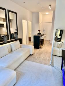 a living room with a white couch and a table at Toronto Downtown Core Condo 2 BED 2 BATH in Toronto