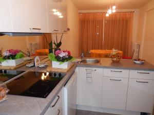 a kitchen with a sink and a counter top at MODERNE 3 PIECES 30 m CROISETTE in Cannes