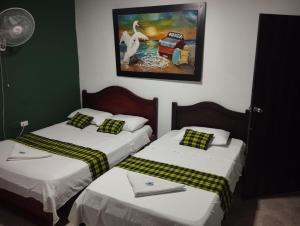 Postel nebo postele na pokoji v ubytování Hotel Sol y Mar