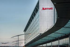 a large building with a airplane on the side of it at Marriott Montreal Airport In-Terminal Hotel in Dorval