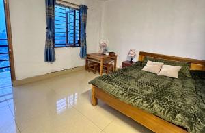 Ένα ή περισσότερα κρεβάτια σε δωμάτιο στο Homestay Núi Đá Tả Phìn