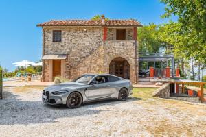 a silver car parked in front of a house at Villa Emozione in Sarzana