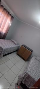 En eller flere senge i et værelse på Casa JARDIM AMÉRICA