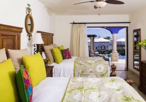 Ένα ή περισσότερα κρεβάτια σε δωμάτιο στο 3BD Hacienda Encantada Stunning Ocean Villa