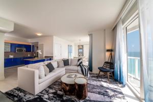 a living room with a couch and a table at W Fort Lauderdale in Fort Lauderdale