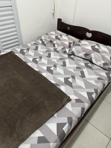 Ένα ή περισσότερα κρεβάτια σε δωμάτιο στο Apartamento Reserva do Sahy