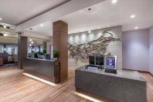 an office lobby with a wall with a mural of a monkey at Madison Marriott West in Middleton