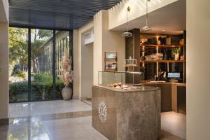a lobby with a reception desk and a counter at Sheraton Cascais Resort - Hotel & Residences in Cascais