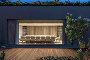 a room with a large window with chairs and a table at Sheraton Cascais Resort - Hotel & Residences in Cascais