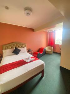 Gulta vai gultas numurā naktsmītnē Hotel SPRING
