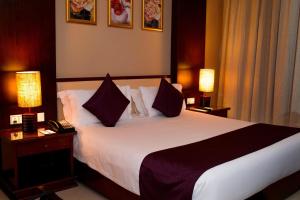 Postel nebo postele na pokoji v ubytování Protea Hotel by Marriott Entebbe