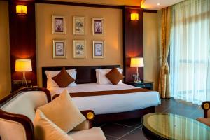 Postel nebo postele na pokoji v ubytování Protea Hotel by Marriott Entebbe