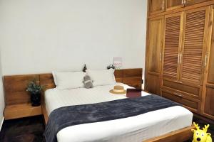 Postel nebo postele na pokoji v ubytování Kim Minh Apartment & Hotel