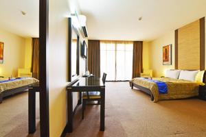 Postel nebo postele na pokoji v ubytování Protea Hotel by Marriott Kampala