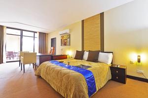 Postel nebo postele na pokoji v ubytování Protea Hotel by Marriott Kampala