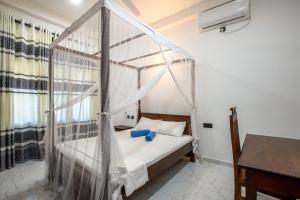 Postel nebo postele na pokoji v ubytování Blueray Villa
