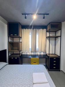 a bedroom with a bed and shelves and a window at Studio Estilo Industrial 03 in Mossoró +10 photos