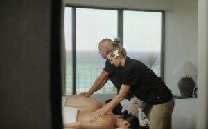 a man and a woman standing next to a large dummy at Lotus Honolulu at Diamond Head in Honolulu +37 photos