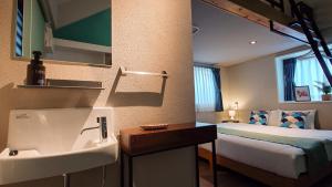 A bed or beds in a room at サンメール座間味アネックス