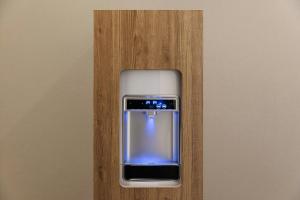 a cell phone is sitting on a wooden wall at Four Points Flex by Sheraton Kyoto Oike in Kyoto