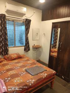 Voodi või voodid majutusasutuse Swanand Home Stay toas