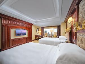 Voodi või voodid majutusasutuse Yueda Financial City International Hotel toas