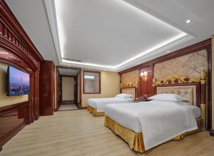 Voodi või voodid majutusasutuse Yueda Financial City International Hotel toas