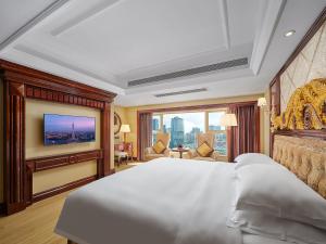 Voodi või voodid majutusasutuse Yueda Financial City International Hotel toas