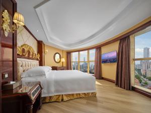 Voodi või voodid majutusasutuse Yueda Financial City International Hotel toas
