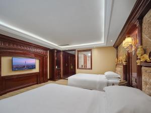 Voodi või voodid majutusasutuse Yueda Financial City International Hotel toas