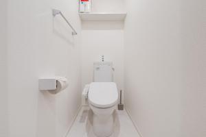a white bathroom with a toilet and a sink at House hotel EKODA 202 HE22 in Tokyo +48 photos