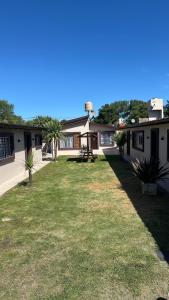 a house with a lawn in front of it at Las Gardenias in Mar del Plata