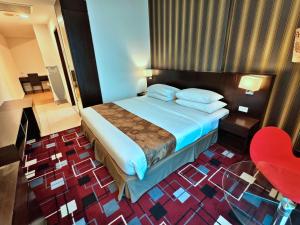 Voodi või voodid majutusasutuse SSL Traders Hotel toas