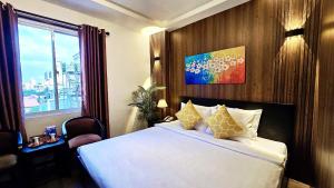 Giường trong phòng chung tại Rosa May Hotel