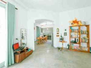 a living room with a table and a dining room at Villa Ciana- Private apartment in Unawatuna