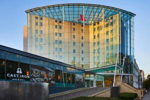 a tall building with a clock on top of it at London Marriott Hotel Kensington in London