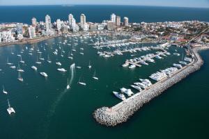 an aerial view of a harbor with boats in the water at Alpes Hotel in Punta del Este