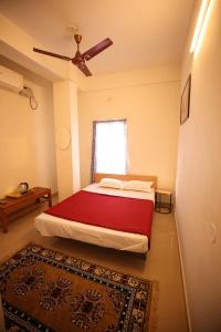 Ένα ή περισσότερα κρεβάτια σε δωμάτιο στο Lishikaa's Inn