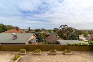 a view from the roof of a house with potted plants at Charming Modern Retreat with Scenic View - Burnside in Burnside