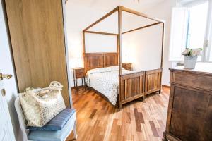 Łóżko lub łóżka w pokoju w obiekcie Perla Pineto Vacanza