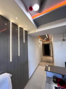 a room with a bed and a desk in a room at HOTEL RK VILLA , Naroda in Ahmedabad