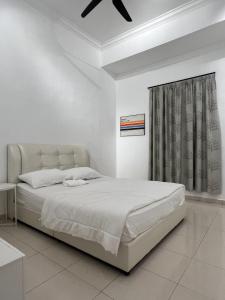 Postel nebo postele na pokoji v ubytování M Guest House