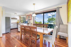 a kitchen and dining room with a table and chairs at Narrow Neck Retreat in Katoomba