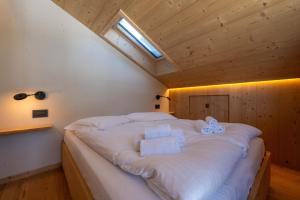 Postel nebo postele na pokoji v ubytování Casa Rocchetta, con vista sulle Dolomiti