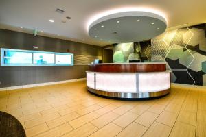 a lobby with a reception counter in a building at SpringHill Suites by Marriott Grand Forks in Grand Forks +21 photos