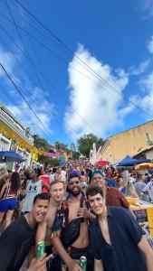 a group of men posing for a picture at a festival at Sobrado Fundição in Recife