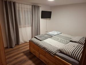 Postel nebo postele na pokoji v ubytování Ferienwohnung Grundnergütl