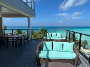 a balcony with chairs and a view of the ocean at Athiri Residence Dhiffushi in Dhiffushi +29 photos