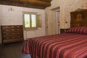 Ένα ή περισσότερα κρεβάτια σε δωμάτιο στο Vittoria Il Graditempo Country House