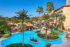 an aerial view of the pool at the resort at The Ritz-Carlton, Dubai in Dubai